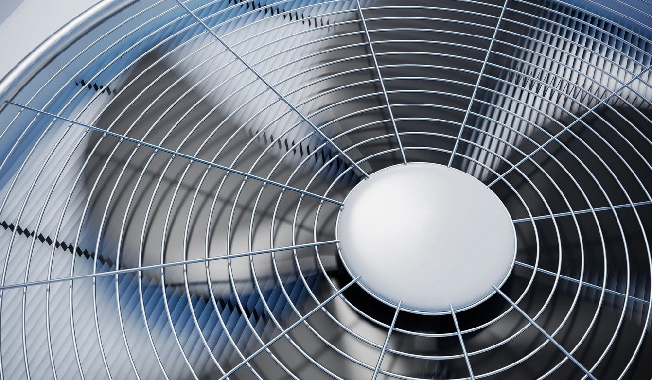 A close up of the fan blades on an air conditioner