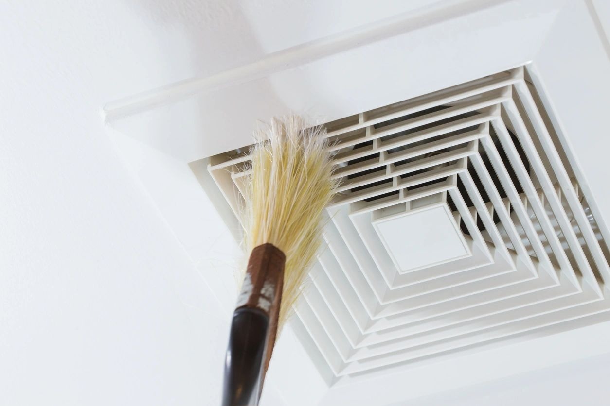 A brush is on top of the air vent.