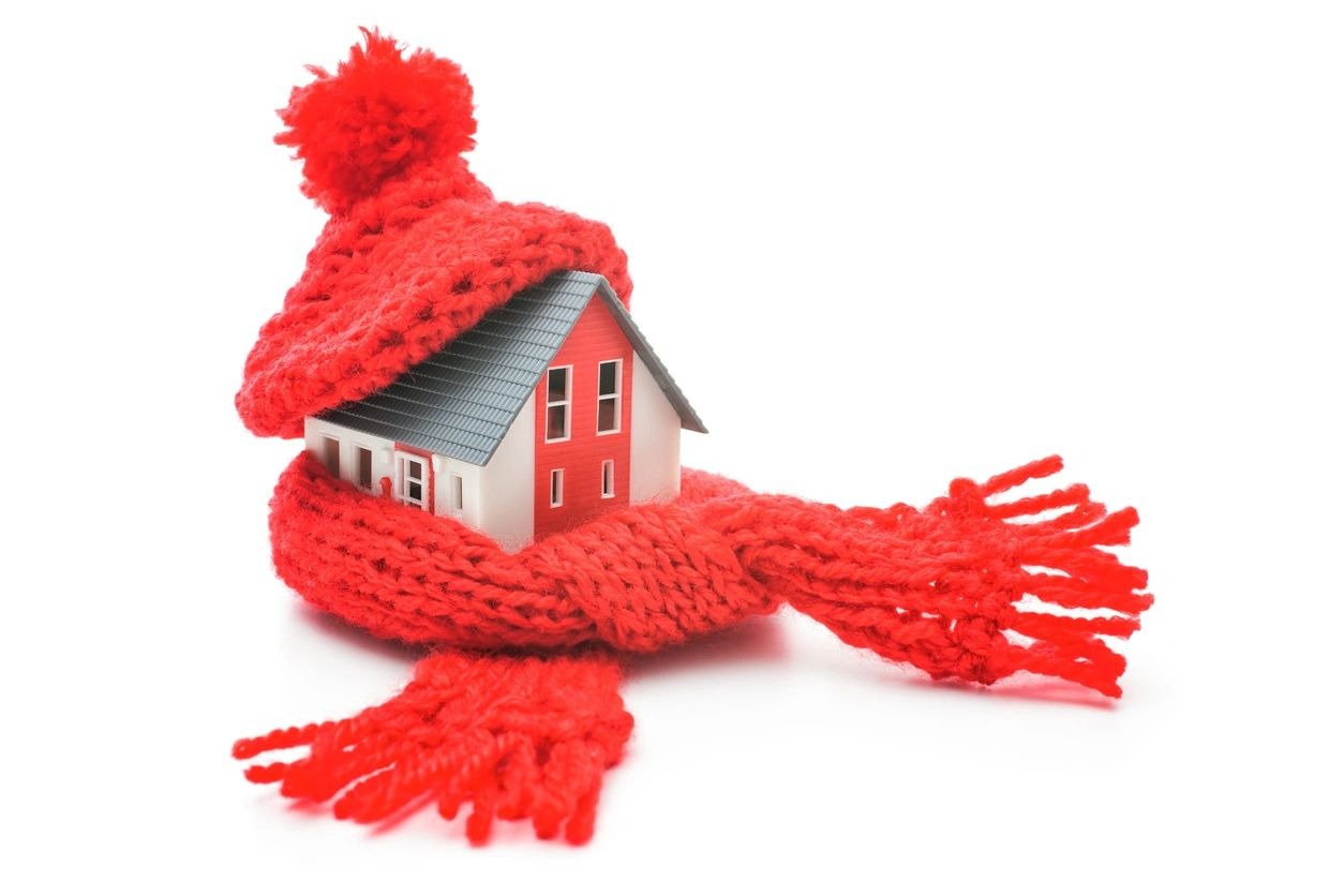 A red scarf with a house in it